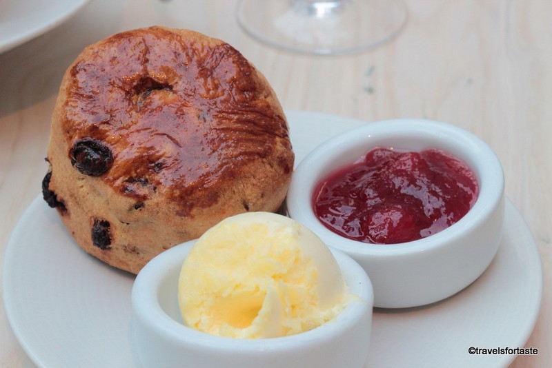 Fresh large scone with clotted cream and preserve at The Wallace Collection